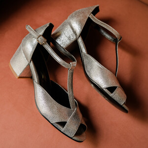 Silver metallic leather T-strap with a small heel