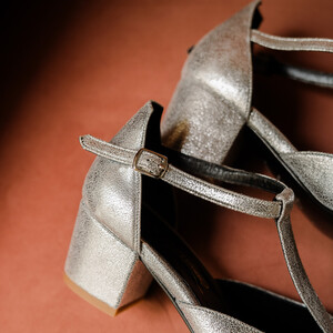 Silver metallic leather T-strap with a small heel